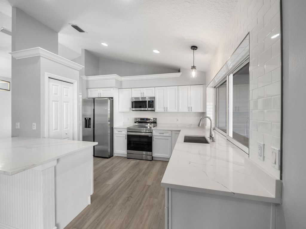 Photo of 1533 SW Fortune Road, Port Saint Lucie, FL 34953 (MLS # R10944628)