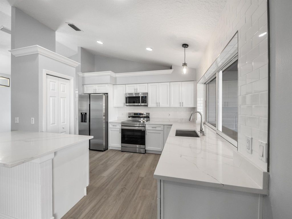 Photo of 1533 SW Fortune Road, Port Saint Lucie, FL 34953 (MLS # R10944628)