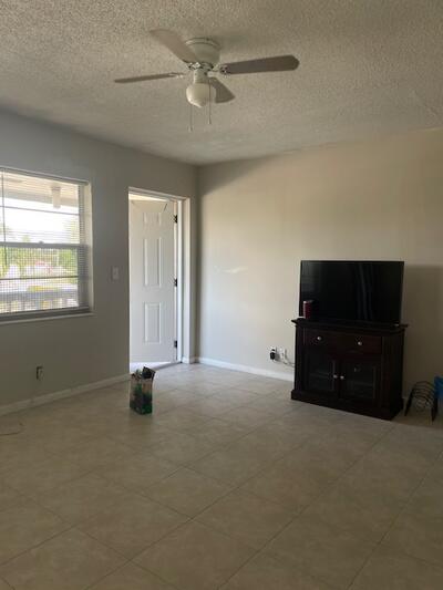 ACTIVE 55+ COMMUNITY - Enjoy comfortable living in this well-maintained unit featuring a newer kitchen, ceramic tile flooring, and a peaceful garden view. Located on a quiet cul-de-sac, the building includes a lift elevator for added convenience. Partially furnished, with furniture negotiable, this home offers flexibility and ease. The community is secured with 24-hour manned gates and roving patrols, and residents have access to an active clubhouse, fitness center, pools, tennis courts, social clubs, and a state-of-the-art theatre. Basic cable is included, adding to the value and convenience of this vibrant lifestyle.