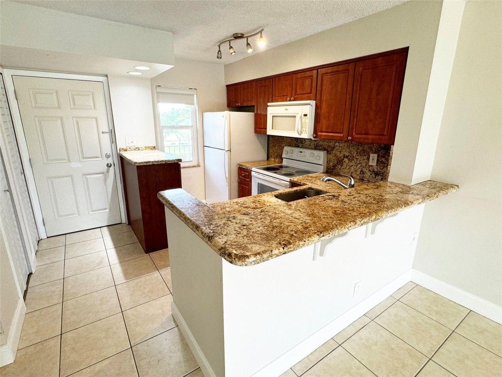 Photo of 2108 S Cypress Bend Drive #309, Pompano Beach, FL 33069 (MLS # F10524397)