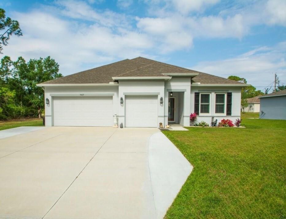 County Living + Modern Comfort- This 2020-built, 4 bed+BONUS ROOM, 3-bath, 3-car garage home offers the perfect blend of tranquility & convenience! Featuring an open-concept - enjoy granite countertops, SS appliances, impact windows, plantation shutters, stunning ship-lap accents on the walls & island, tile & wood flooring throughout, and a serene fenced-in back yard w/plenty of space to garden & explore. The screened-in lanai provides the perfect retreat, while the new whole-house air & water purification system ensures peace of mind. NO HOA--bring all your toys! ASSUMABLE VA LOAN available!