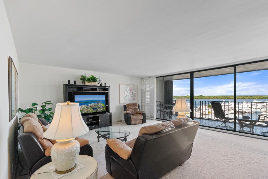 Amazing views of the Ocean, Bay, and Marina from this deluxe floor plan condo in Old Port Cove. Enjoy two covered balconies, one off the spacious 19x18 living and dining room, and another off the large master bedroom. Formal dining area offers beautiful water views, and the kitchen features stainless steel appliances and is partially open to the dining space. The master suite includes private balcony access and a spacious master bathroom with dual sinks, a soaking tub, and a walk-in shower. The guest bathroom also has a walk-in shower. Full-size washer and dryer inside the unit. Old Port Cove is a secure, beautifully maintained condo and marina community with an on-site restaurant. Amenities include a lap pool, fitness center, saunas, community room, and more.