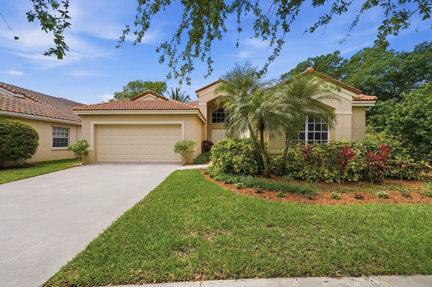 Desirable Bloomfield model with long, sparkling lake view and lush landscaping with neighbor on one side only*Roof new in 2017*Brand new entrance way tiles*Light-filled home with vaulted ceilings, neutral floors and paint throughout*beautifully remodeled kitchen*convenient split floor plan incl. large primary suite, also with vaulted ceiling*separate laundry room with window*highly-rated Weston schools*guard gated community yet with excellent access to highways, stores, houses of worship, parks and all Weston has to offer*see today!