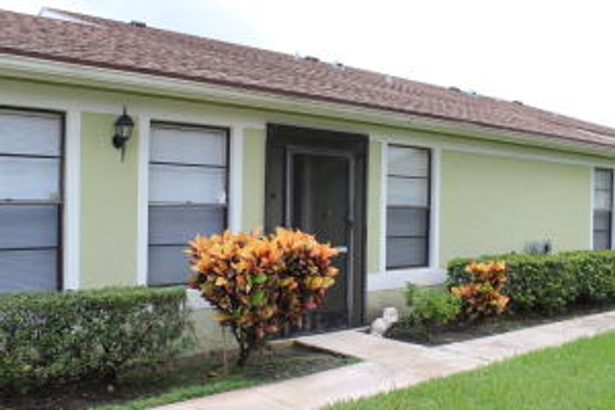 This is a 3/2 villa with all popcorn ceilings removed, walls refinished and new flooring in the bedrooms and living room.  Nice screened patio for outdoor seating.  Two parking places with one directly in front of the unit. This is a very clean unit ready to move in great shape.Excellent location close to schools, shopping, bus stop and post office.2 pools, playground, tennis courts and club house library and billiard room.  Workout equipment and sidewalks for long walks.