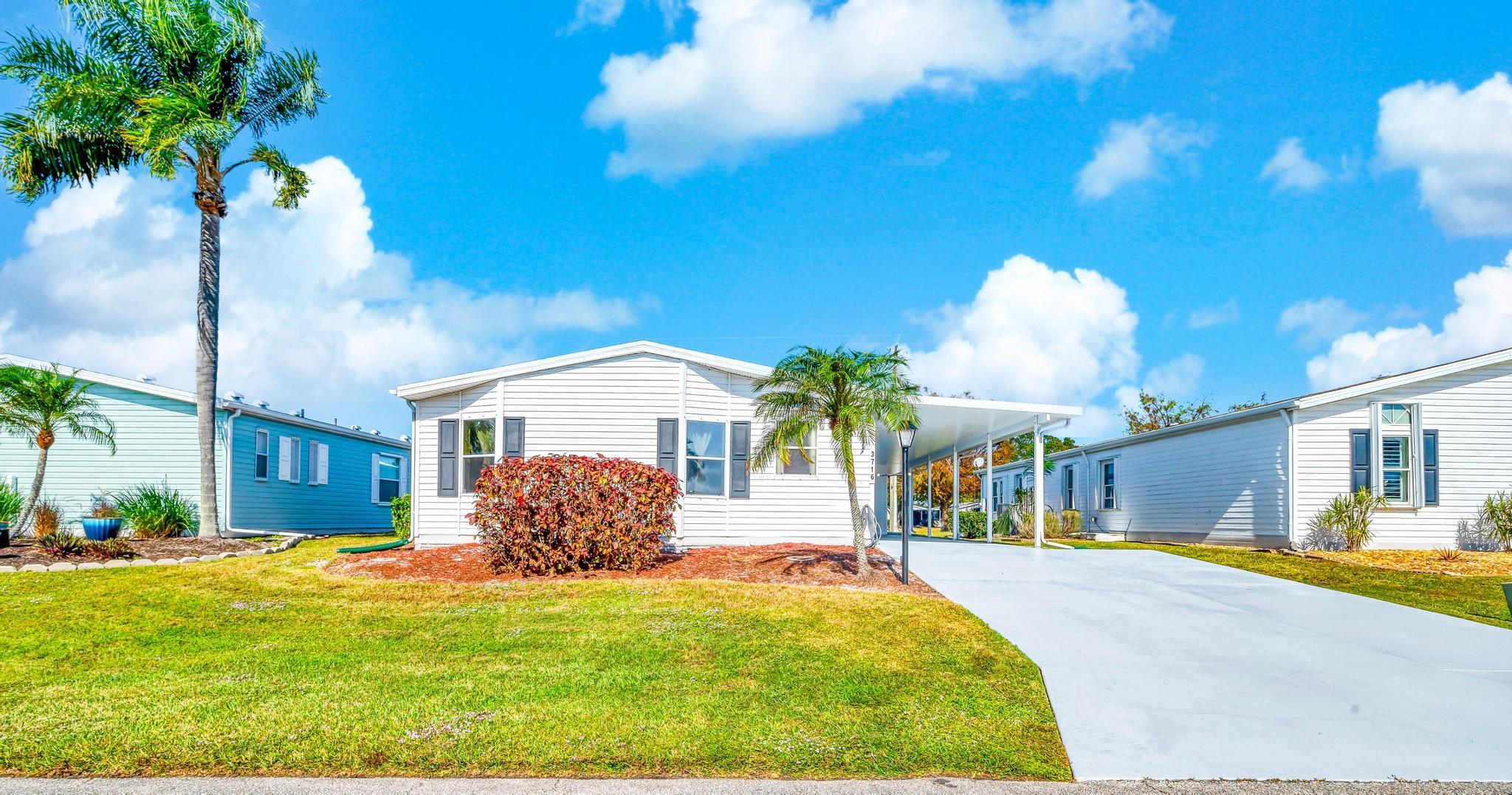 Enjoy stunning lake views and modern upgrades in this beautifully updated 2BR, 2BA home with a bonus room/office overlooking the water. Relax on the covered patio or admire the enhanced front landscaping and curb appeal. Inside features include a remodeled kitchen with granite counters, new appliances, fresh paint, laminate flooring, new A/C, water heater, ceiling exhaust fans, and more. Crawl space upgrades and a weatherization evaluation boost energy efficiency. Located in a vibrant 55+ community offering 3 clubhouses, pools, fitness center, libraries, an 18-hole golf course, and on-site dining.