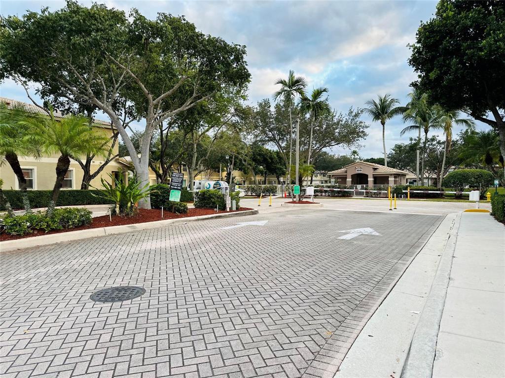 Photo of 8537 W SOUTHGATE SHORES Circle E, Tamarac, FL 33321 (MLS # B26082108)