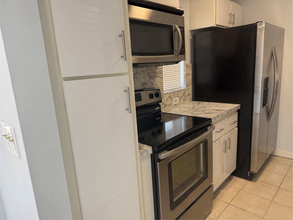 Photo of 9930 N Twin Lakes Drive #7-L, Coral Springs, FL 33071 (MLS # F10538521)