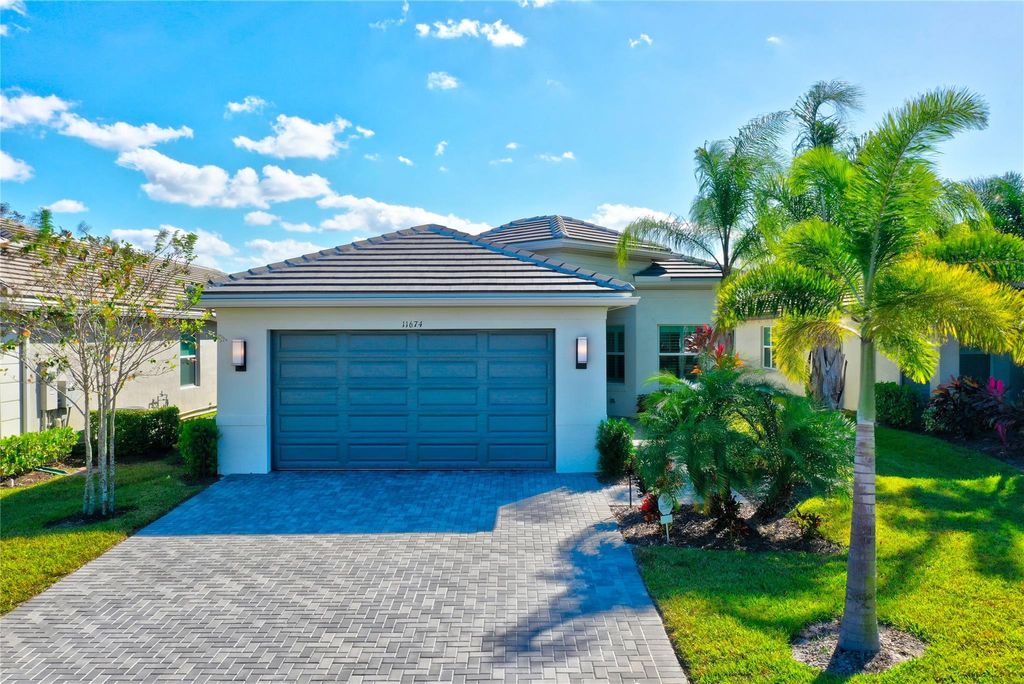 Photo of 11674 SW Golden Falls Ln, Port St Lucie, FL 34987 (MLS # F10402496)