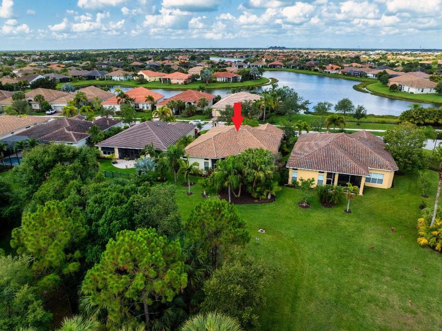 This beautifully designed 3-bedroom, 3.5-bath home with a versatile den offers exceptional living space, thoughtful layout, high-end features throughout, and BRAND NEW APPLIANCES. Built with quality and durability in mind, the home features a classic barrel tile roof and impact-resistant windows for enhanced safety and energy efficiency. Inside, you'll find a large open floor plan that seamlessly connects the oversized family room and spacious living room, creating an ideal setting for entertaining or relaxing. The upgraded kitchen is a standout, boasting 42-inch cabinetry, and rich granite countertops -—perfect for the home chef. The expansive master suite is a private retreat, complete with dual walk-in closets and luxurious his-and-her bathrooms. On the opposite wing of the home, two generously sized guest bedrooms, each with access to full bathrooms, along with a private den, offer a perfect setup for visitors, extended family, or a home office. Step outside to a screened and covered lanai that overlooks a peaceful nature preserve, surrounded by upgraded, meticulously maintained landscaping that enhances the home's serene and private ambiance.