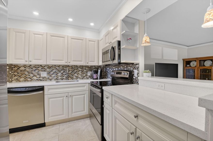 Seller motivated!  Completely renovated first-floor 2-bedroom 2-bath condo with gorgeous high-end finishes throughout. This move-in ready home features a sleek kitchen with quartz countertops and custom cabinetry, porcelain tile flooring, upgraded lighting and fixtures, crown molding with accent lighting, in-unit washer and dryer. Ideally located near the Flanders clubhouse in Kings Point Golf & Country Club, offering resort-style amenities including indoor/outdoor pools, fitness center, pickleball, tennis, theater, courtesy bus service, and a wide variety of clubs and activities.