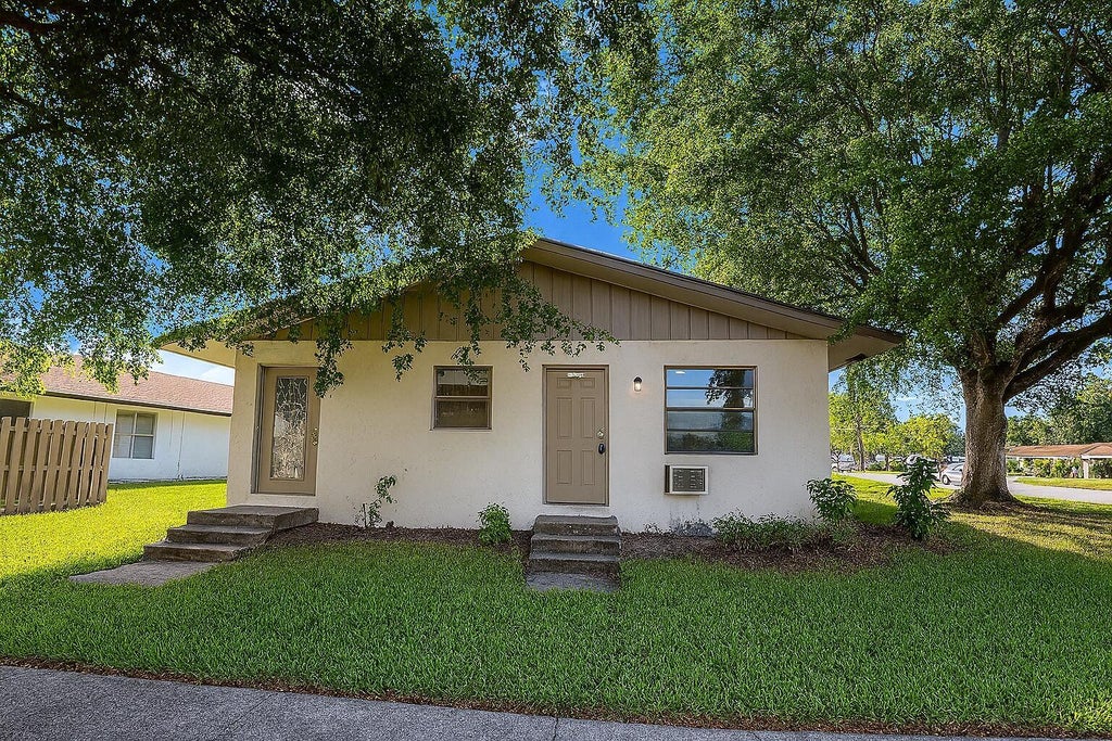 Photo of 3539 Melaleuca Lane, Lake Worth, FL 33461 (MLS # B26078358)