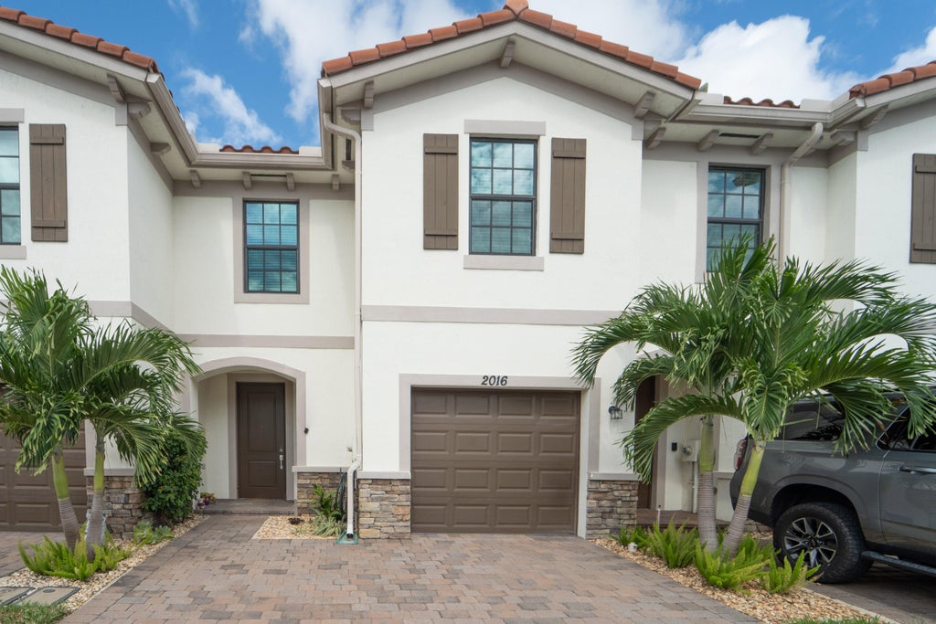 Photo of 2016 Sugar Maple Drive, Riviera Beach, FL 33410 (MLS # B26090501)