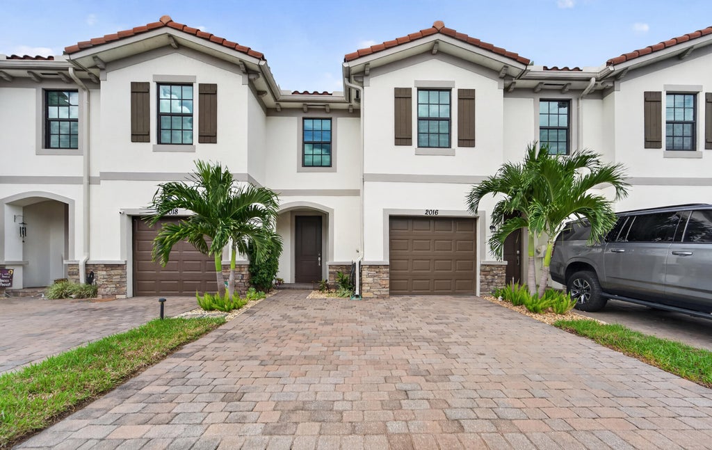 Photo of 2016 Sugar Maple Drive, Riviera Beach, FL 33410 (MLS # B26090501)
