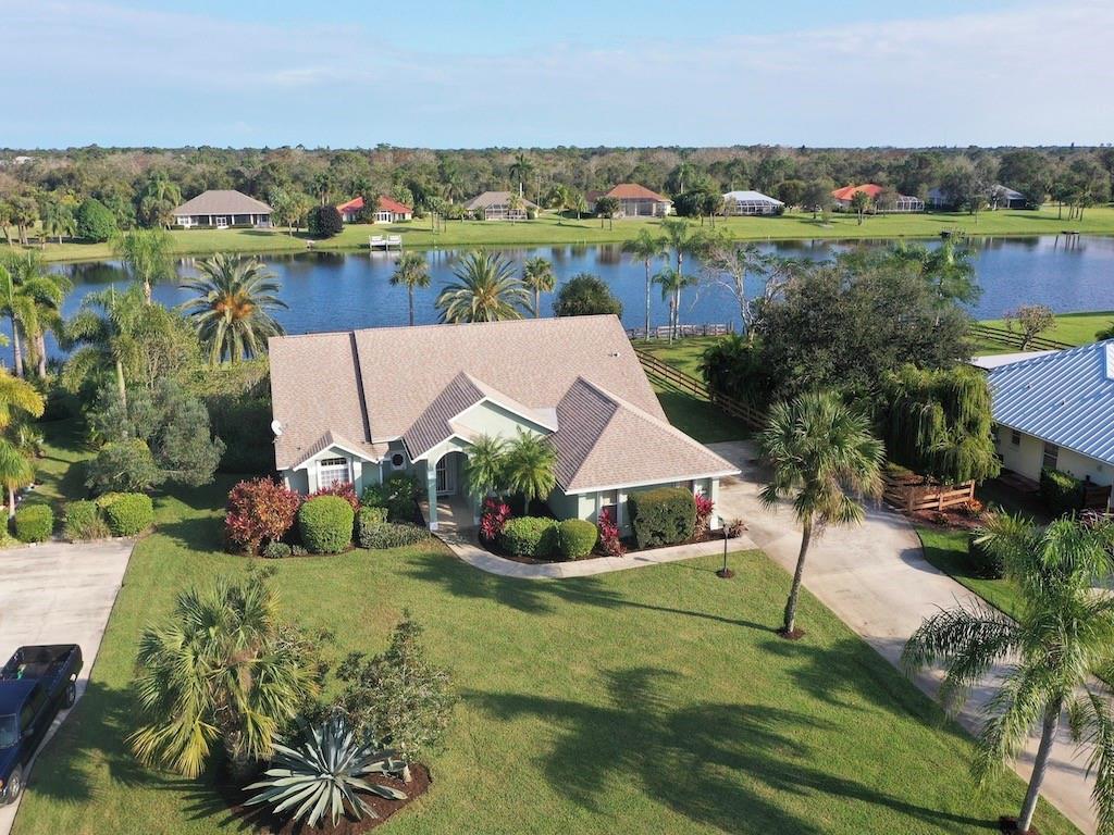 CUSTOM POOL HOME WITH COVETED EAST EXPOSURE LAKE VIEW. A NATURE LOVER'S DREAM AS COMMUNITY IS TUCKED IN A 22,000 ACRE NATURAL PRESERVE. SPLIT PLAN W/THREE BEDROOMS, 2 BATHS, 3 CAR GARAGE, OVERSIDED LAUNDRY ROOM, BREAKFAST NOOK AND SPACIOUS LIVING ROOM WITH POOL/SPA VIEW OVERLOOKING THE 17 ACRE AERATED LAKE. NEWER ROOF, ACCORDIAN SHUTTERS AND NEW AC ARE JUST A FEW OF THE UPGRADES. COMMUNITY HAS TENNIS, PICKLE BALL AND CLUBHOUSE FOR ALL OF YOUR ENTERTAINING NEEDS. PRIVACY ABOUNDS YET ONLY 2 MILES FROM I 95 AND CLOSE TO ALL CONVENIENCES. ALL LOTS GO TO THE CENTER OF THE LAKE.