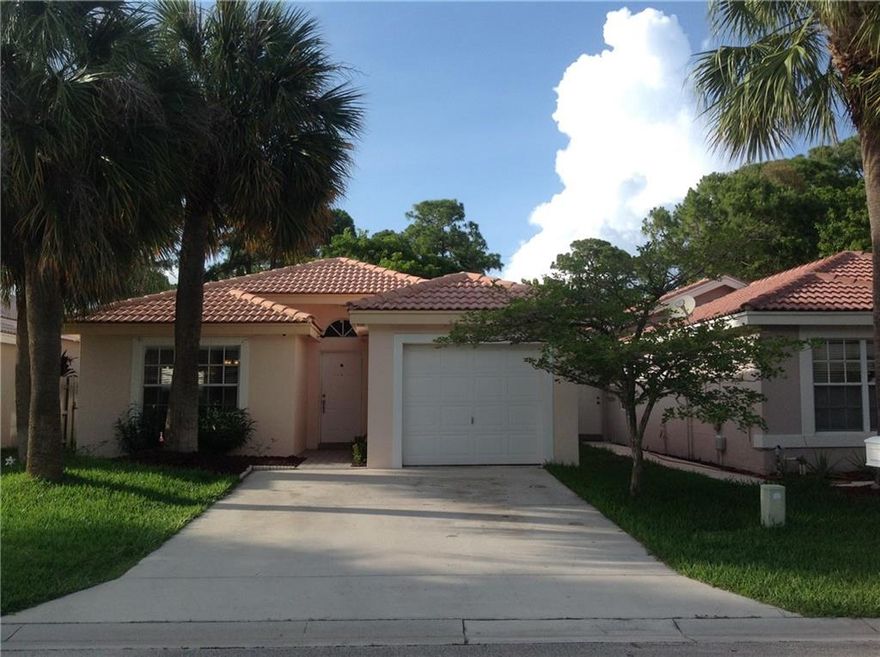 Cozy move in ready one story single family home in a gated community with playground, clubhouse, large community pool, fitness center, tennis and basket ball courts, mature trees, and of easy access to shopping. Open floor plan, with lots of windows, large living room, bright and airy, Large back yard. Hurricane panels. Just the perfect starter home! Bring your best offer. Seller is motivated!