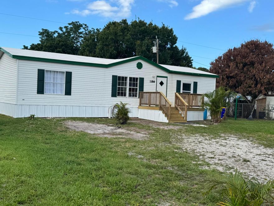Three-bedroom, 2 bath manufactured home built in 1994. Seller has updated the property including but not limited to brand new central A/C system, front entry stairs, interior paint, some light fixtures, kitchen sink & faucet, exterior skirting, waterproof roof coating and more. Split bedroom plan, roman tub with separate shower in primary bathroom, inside laundry room, cathedral ceilings. Storage shed. Water filtration system. YOU OWN THE 75' X 100' LOT. No HOA! Easy access to I-95.  This affordable home is expected to sell quickly.  Mortgage financing available. Possible seller financing. Septic system was pumped out 05/2026. Water heater 2022.