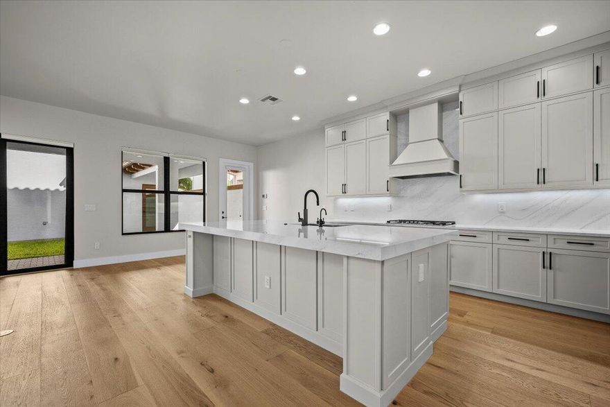 One of the newest homes in Alton. Showcasing organic modern design and advanced smart home technology on a quiet, no-through street in Palm Beach Gardens' most sought-after community. This Exeter/Park C plan offers abundant natural light and a private-entry casita ideal for guests, multigenerational living, or a home office. The home includes every builder upgrade plus extensive post-construction enhancements, including Level 5 plaster walls, hardwood floors throughout, upgraded interior/exterior paint, glass doors, and a chef's kitchen with GE Monogram smart appliances. Solar with three Tesla Powerwall batteries, Span smart panels, smart lighting, whole-home water filtration with reverse osmosis, integrated security, and EV charging deliver exceptional efficiency and comfort.