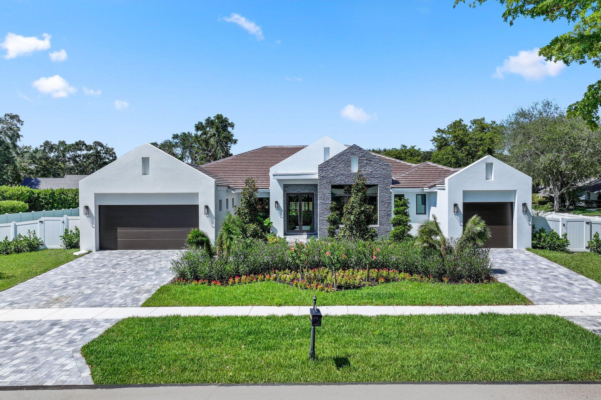 Gorgeous one story contemporary 5 BR + Media Room and Study and Playroom / 5 BA / 1HB new construction home in the Woodfield Hunt Club. With soaring ceilings, striking 48x48'' porcelain tile floors, and top-of-the-line luxury appliances, this home is truly unmatched. The primary suite boasts wood flooring and a luxurious bath with a glass shower, soaking tub, and exquisite porcelain tile. Find a media room, playroom and ensuite bedrooms. Outdoors, a full summer kitchen, custom pool, and large yard featuring lush landscaping complete the picture. Additional upgrades include a split 3-car garage and custom, premium finishes.Optional membership available to Woodfield Country Club.