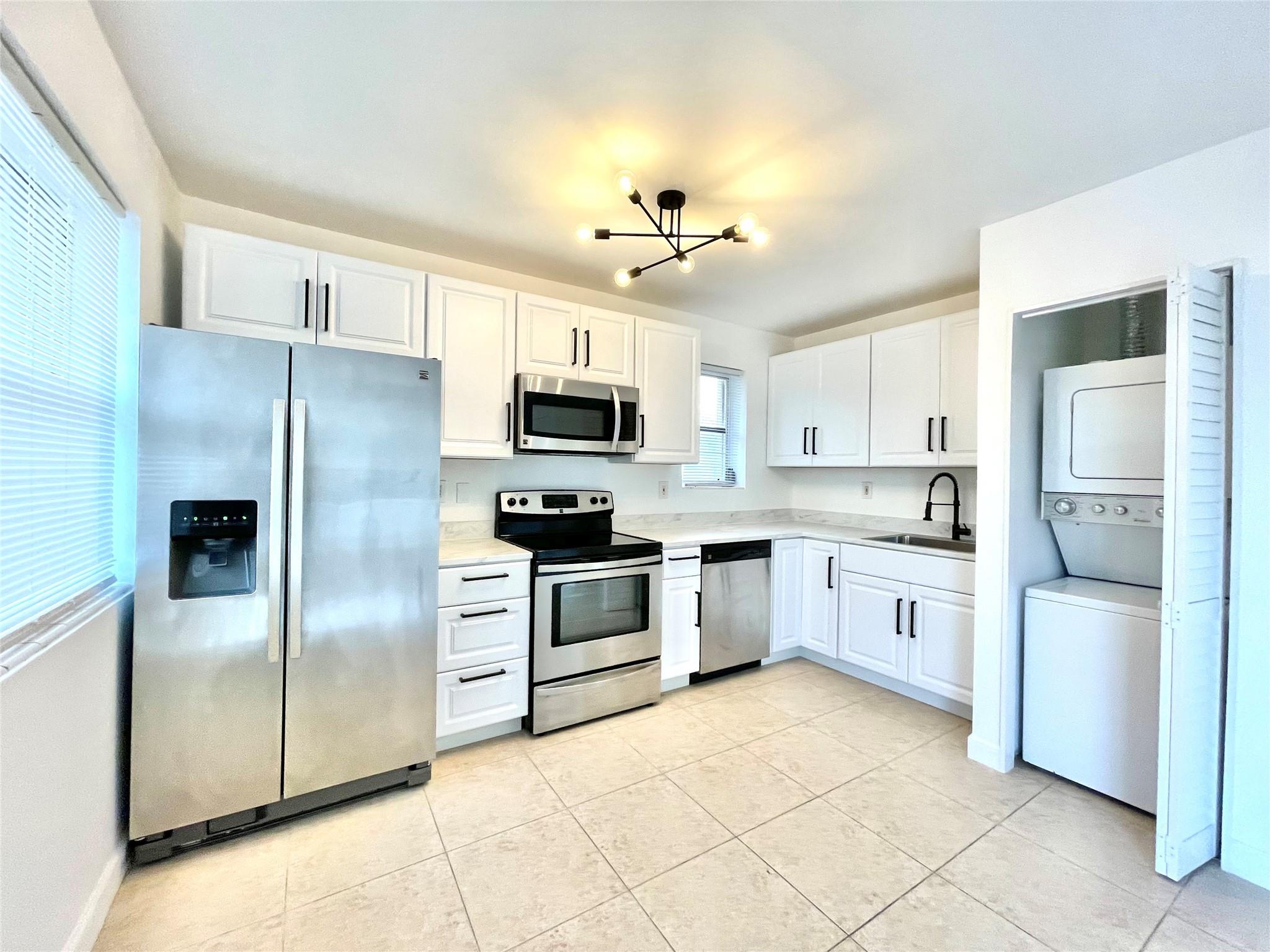 Beautifully Renovated Corner Unit, Laundry inside this spacious 1/1 with a Den which can be second bedroom, along with an extra storage room. Modern living with a brand new kitchen featuring stainless steel appliances. Enjoy the spaciousness of a bright living area with one bedroom and the convenience of a den perfect for an office or guest room. The updated bathroom & serene pool view from the bedroom add to your comfort. Relax on the wrap-around balcony or stay active with the gym conveniently located below. You're walking distance to a vibrant strip with a brewery, coffee shop, restaurant, and karaoke bar. Just 5 mins from Wilton Manors and 3 mins to US1, this location can't be beat! Can be rent right away. 1 parking spot only. Low HOA includes water, gym and pool.