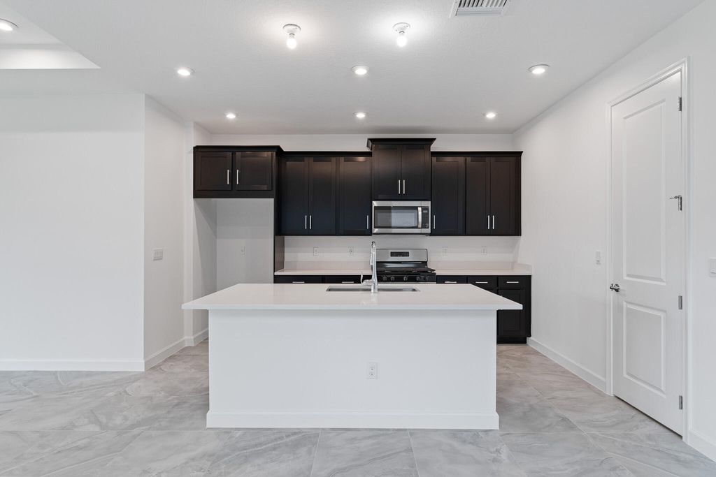 Photo of 9093 SW Remy Lane, Port Saint Lucie, FL 34987 (MLS # R10971851)