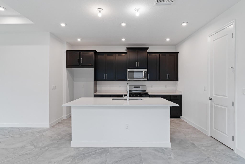 Photo of 9093 SW Remy Lane, Port Saint Lucie, FL 34987 (MLS # R10971851)