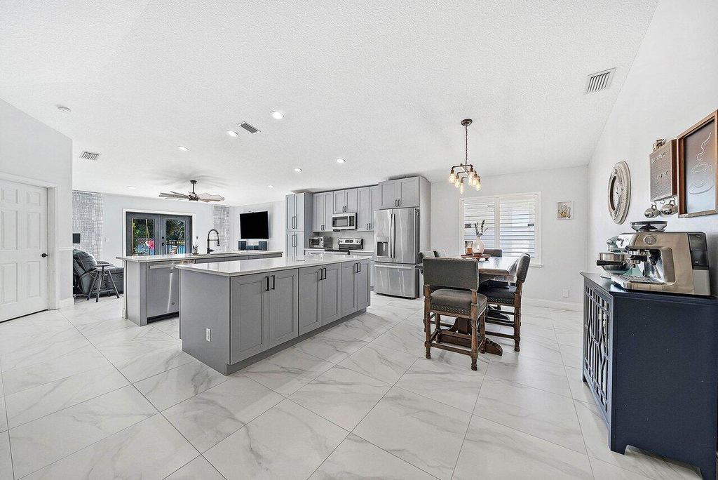 Photo of 5230 Canoe Bend Drive, Lake Worth, FL 33463 (MLS # R11150600)