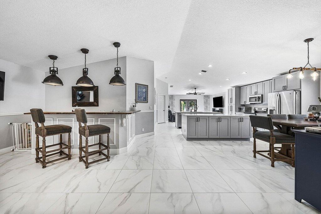 Photo of 5230 Canoe Bend Drive, Lake Worth, FL 33463 (MLS # R11150600)