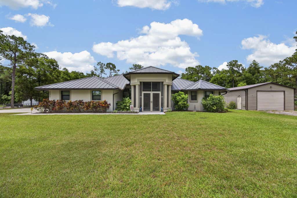 Photo of 17377 W ALAN BLACK Boulevard, The Acreage, FL 33470 (MLS # B26060929)