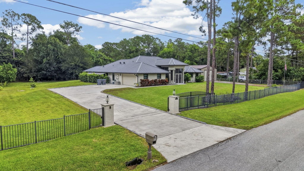 Photo of 17377 W ALAN BLACK Boulevard, The Acreage, FL 33470 (MLS # B26060929)