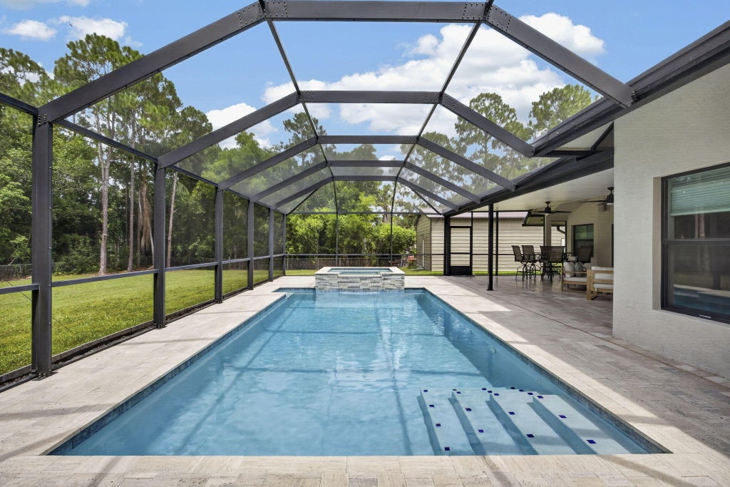 Photo of 17377 W ALAN BLACK Boulevard, The Acreage, FL 33470 (MLS # B26060929)