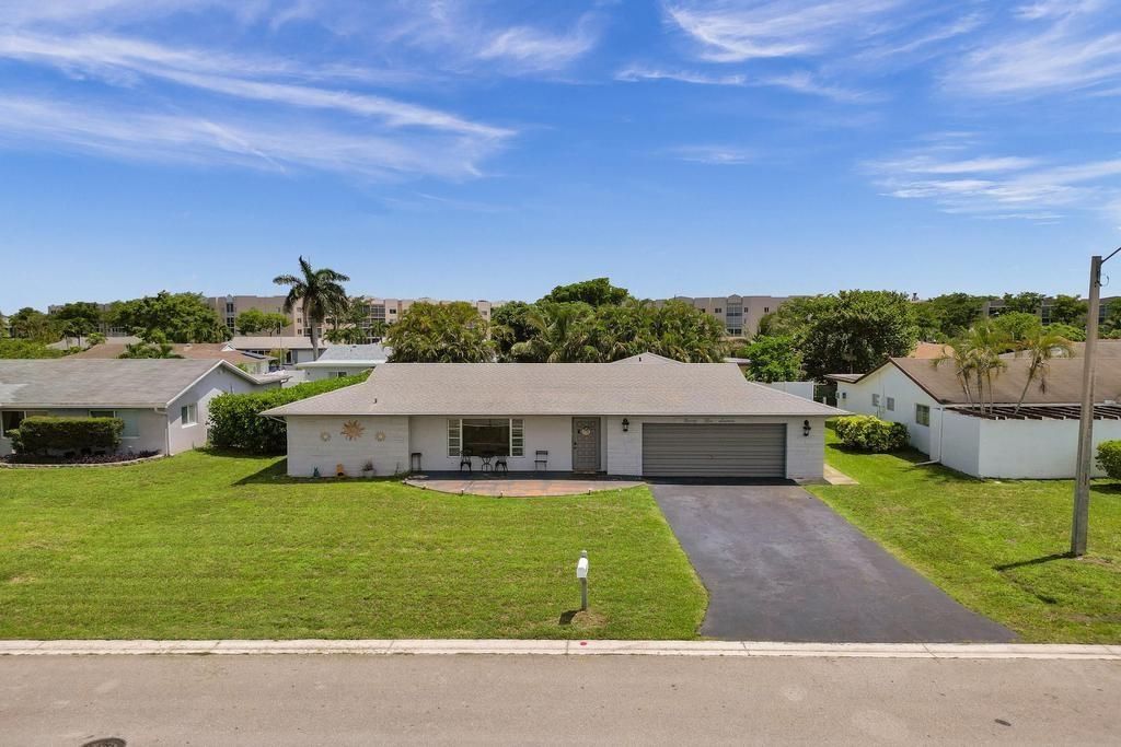 Photo of 9516 NW 80th Ct, Tamarac, FL 33321 (MLS # F10543055)