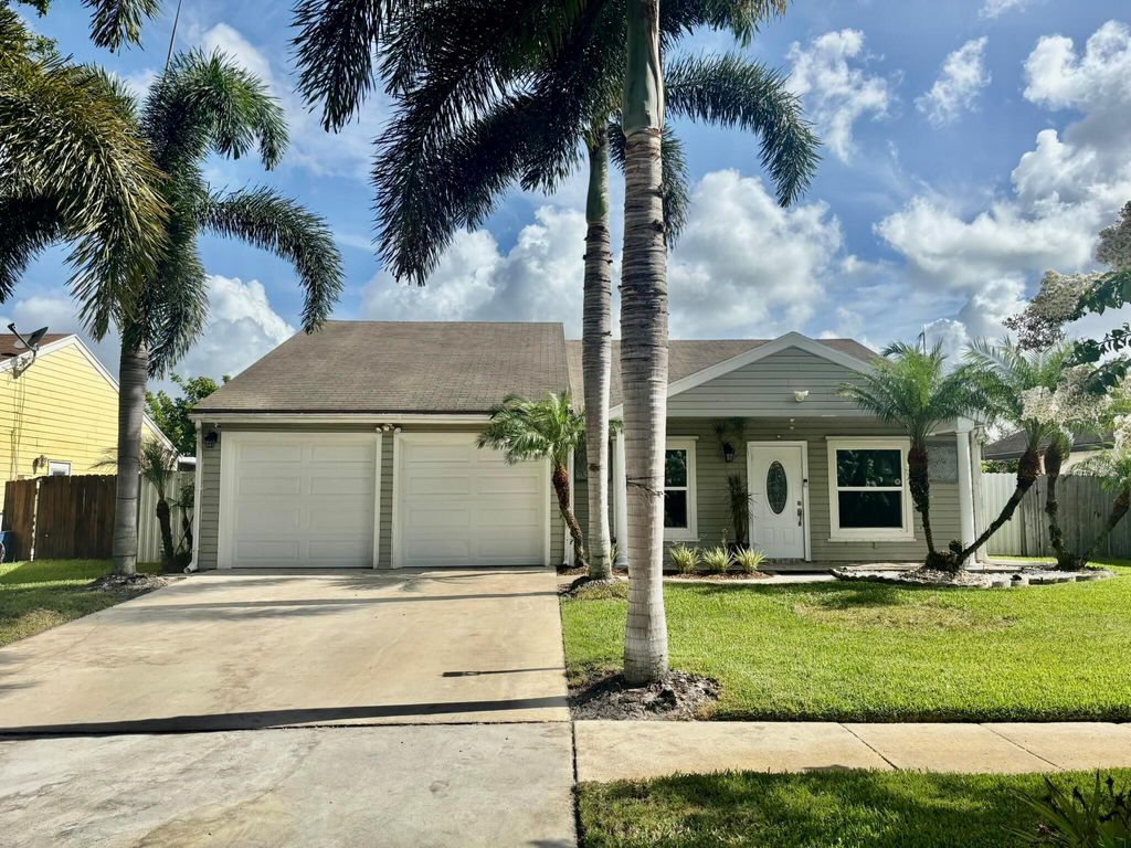 Photo of 7927 Bishopwood Road, Lake Worth, FL 33467 (MLS # R11099800)