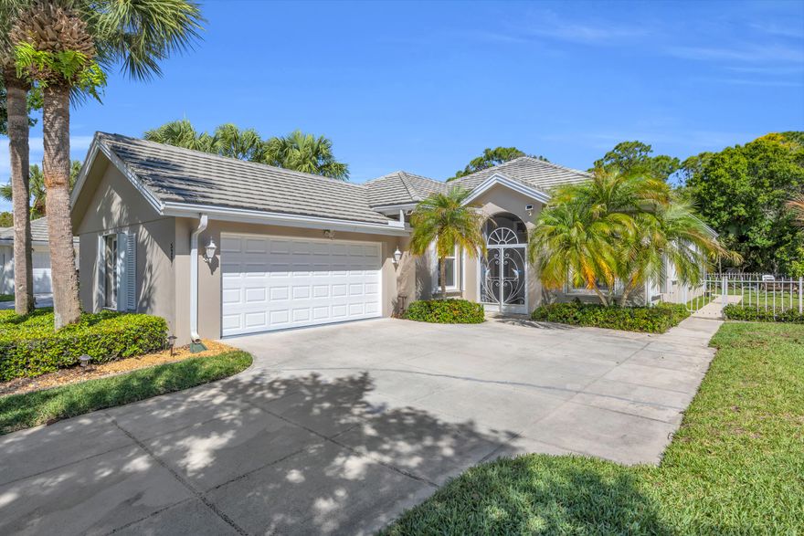 Welcome to this beautifully maintained Divosta-built Hampton model in the highly desirable Preserve of Hobe Sound. This solid CBS home offers 3 bedrooms, 2 bathrooms, and a 2-car side-entry garage, featuring a bright open layout with vaulted ceilings and a split floor plan for added privacy. The spacious primary suite includes two walk-in closets and dual vanities, while the fenced backyard backs to a peaceful preserve, creating a private and serene setting. Recent updates include impact windows (2024), fresh exterior paint (2024), and a UV light installed in the attic (2025). Located close to the community entrance for convenience, The Preserve offers gated security along with amenities including a clubhouse, heated pool, tennis courts, and lawn care, making this a move-in ready home with both comfort and lifestyle in mind.