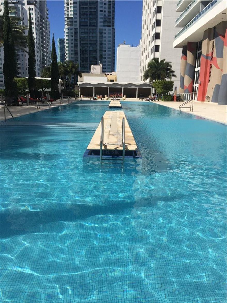 See the amazing sunset and city views while also being able to enjoy the bay view from the wrap around balcony and bedroom. White glass porcelain floors continuous into bathrooms and 3 walk in closets. Beautiful modern kitchen. Amenities include a fitness center overlooking the bay with wet/dry saunas, infinity pool with hot tub and cabanas. Along with the impressive 3 story lobby the building offers 24/7 valet/concierge and an elegant party room as well as a separate casual room.