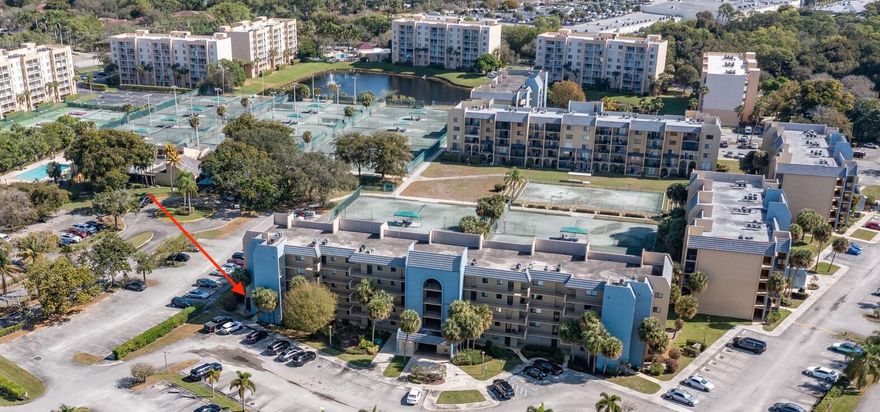 Discover the ultimate lifestyle in this spacious 1,200 sq. ft. ground-floor corner unit at the Tennis Club of Palm Beach. This 2-bed, 2-bath condo features an open-concept layout with a screened terrace, perfect for enjoying the Florida breeze. Located in a non-gated, investor-friendly community with no age restrictions, it offers immediate rental potential.  Step outside to world-class amenities including 22 Har-Tru clay courts, pickleball, an Olympic-size pool, a fitness center, and a social clubhouse. Your monthly dues cover water, basic cable, trash, and exterior maintenance for stress-free living. Situated just minutes from PBI Airport, the Palm Beach Outlets, and local beaches, this unit combines convenience with a resort feel. Ideal for players and investors alike! Min 650 credit