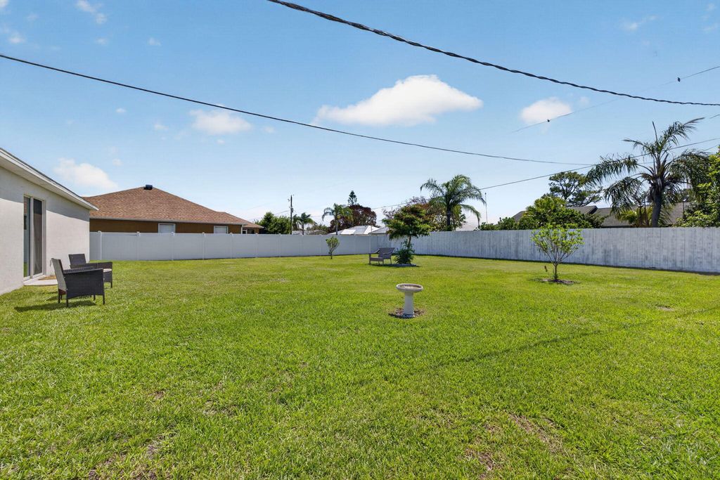 Photo of 718 SW Curry Street, Port Saint Lucie, FL 34983 (MLS # B26025485)