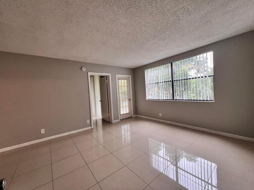 Photo of 700 EXECUTIVE CENTER Drive #211, West Palm Beach, FL 33401 (MLS # B26081138)
