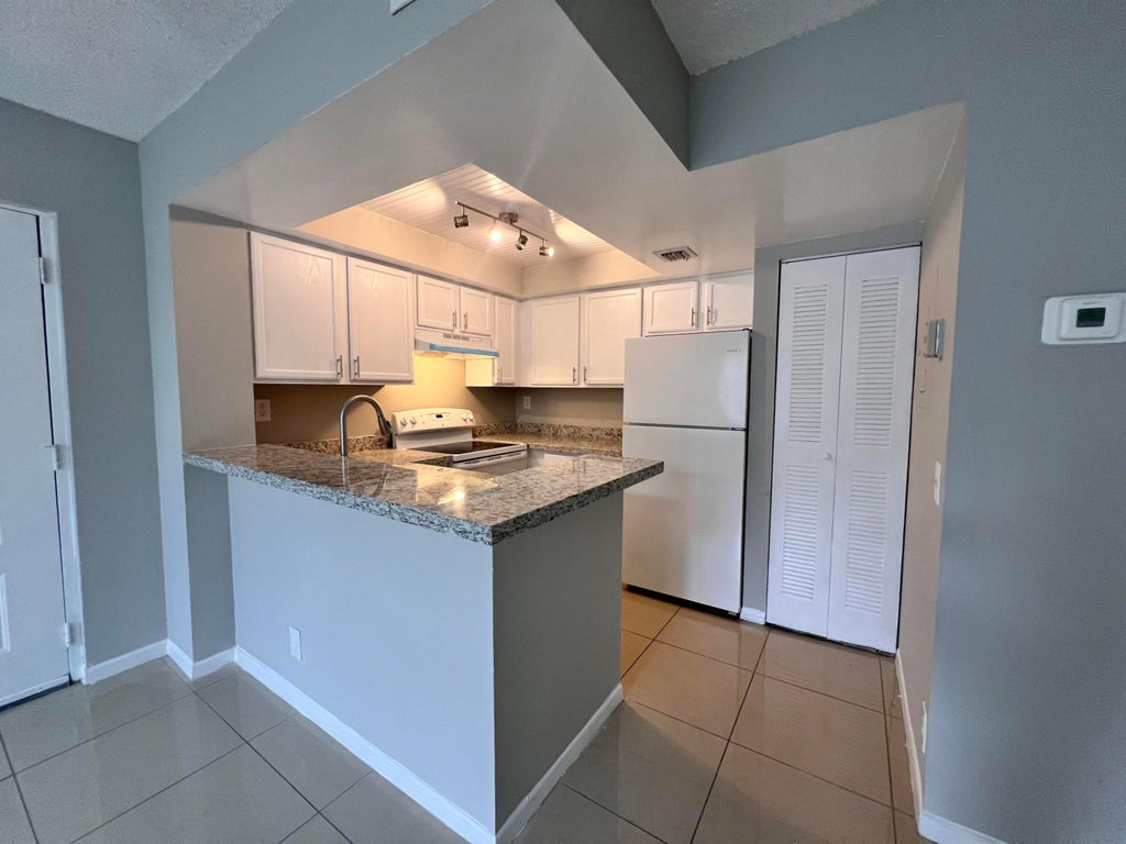 Photo of 700 EXECUTIVE CENTER Drive #211, West Palm Beach, FL 33401 (MLS # B26081138)