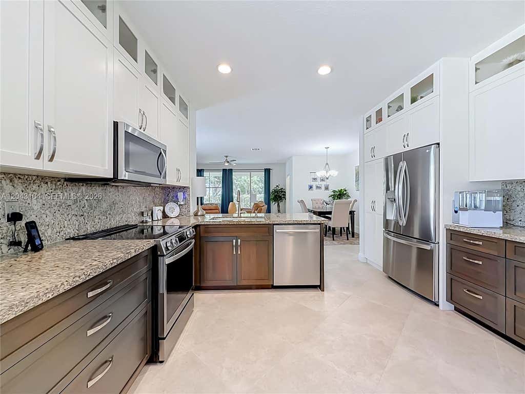Photo of 1556 Winterberry Lane, Weston, FL 33327 (MLS # A12043104)