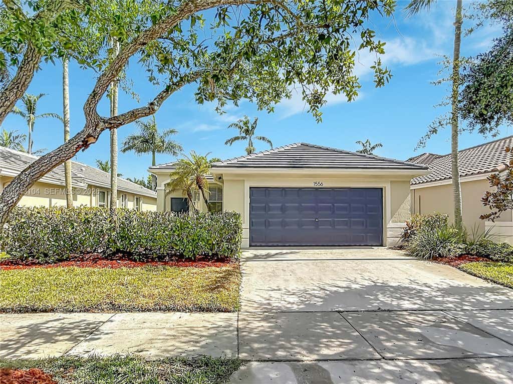 Photo of 1556 Winterberry Lane, Weston, FL 33327 (MLS # A12043104)