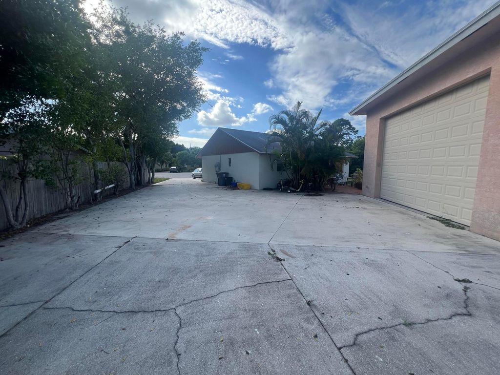 Photo of 1309 W Frangipani Circle, Lantana, FL 33462 (MLS # R11139542)