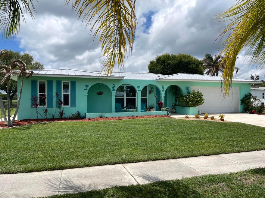 Location! Location! Location! Fantastic Opportunity To Live In The Much Sought After Sandpiper Bay Community! This Warm & Inviting Home Features A 2021 METAL ROOF, 2 Bedrooms with Remodeled Primary Bedroom Closet, 2 Full Updated Baths, Updated Kitchen Including 2025 LG Refrigerator & Range, TWO Car Garage With 2024 Hurricane Rated Door, Screened In Patio With View of The Sandpiper Bay Resorts Green Space. Updated Tile Throughout with Carpet In Bedrooms. New A/C & Ductwork Installed 2016. NO HOA! PARK YOUR BOAT, RV, TRAILER! Sandpiper Bay Is Home To The Port District On The North Fork of The Saint Lucie River At The Port Saint Lucie Botanical Gardens W/River Walk, Canoe/Kayak Launch, Playground, Music Venue. Close To Shopping, Restaurants, Hutchinson Island Beaches. Miles of Hiking Trails.