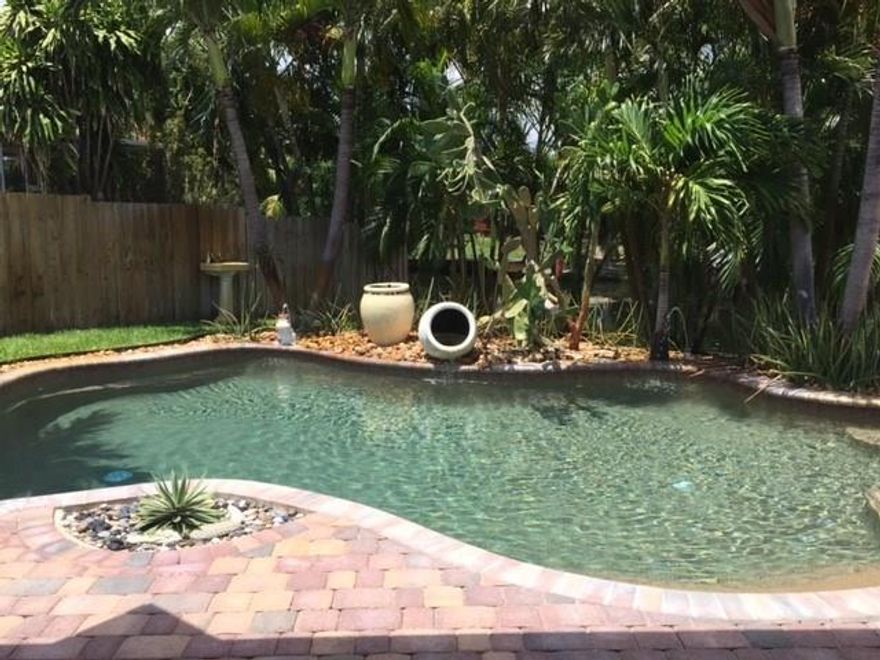 JUST REDUCED FROM $399,000. TO $350,000.!!!  RUN DON'T WALK!!!  SELLER WANTS IT SOLD!!! OCEAN ACCESS . 70 FT ON CANAL. FLOATING DOCK AND BOAT LIFT (4,500 LBS) SALTWATER POOL. 2 SPLIT MASTER SUITES. 3rd BEDROOM OPENED TO 1 MASTER SUITE AS SITTING ROOM. 4 SLIDING GLASS DOORS (W/ACCORDIAN SHUTTERS) OPEN TO COVERED LANAI, POOL AND CANAL. HURRICANE IMPACT WINDOWS. TILE THRU-OUT.   NEWER EVERYTHING!!!   ROOF, A/C, APPLIANCES, W/D, PAVERS, TANKLESS HWH, ALARM SYSTEM. EASY TO SHOW!