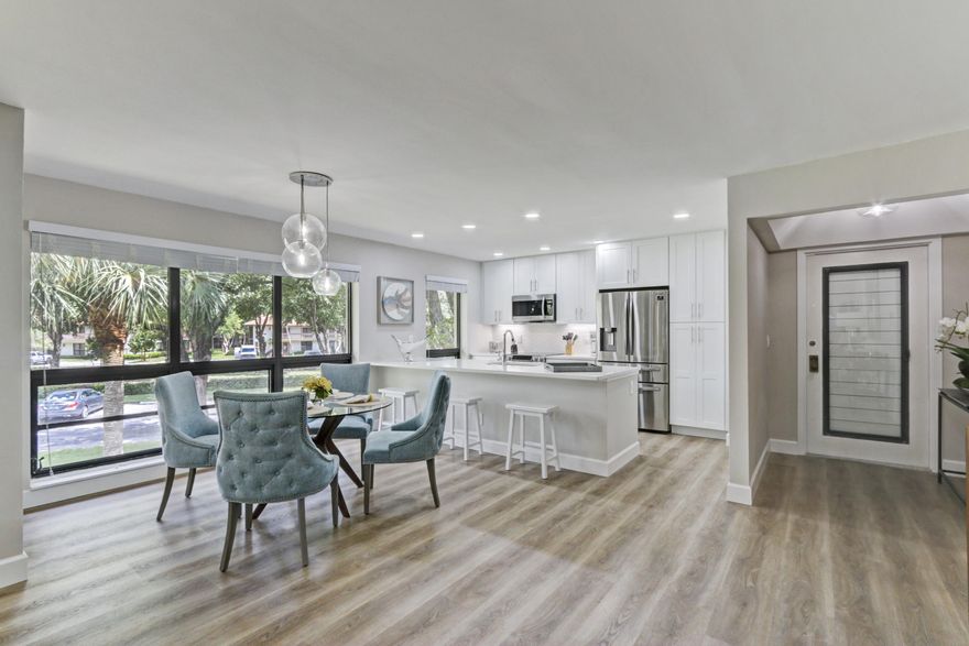 PGA NATIONAL Golf Villas. This amazing unit has been totally renovated and updated. Everything is new including all flooring, kitchen, baths, appliances, electronics (all LED Smart TV's), H2O Heater, AC, window treatments, plumbing and lighting fixtures. Quartz countertop throughout. King size bed in master and queen in guest room. Wrap around screened balcony. Cable, internet, water, trash, electric (capped at $80/mo) are all included. No smokers or pets.