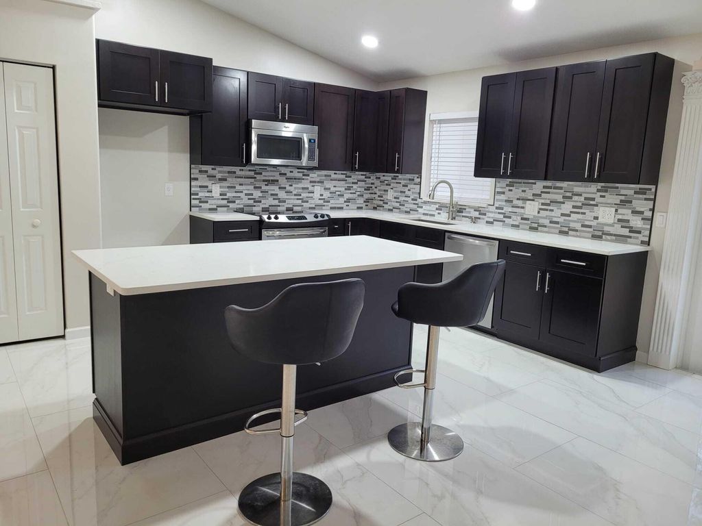 Photo of 7605 Woodland Creek Lane, Lake Worth, FL 33467 (MLS # R10976194)