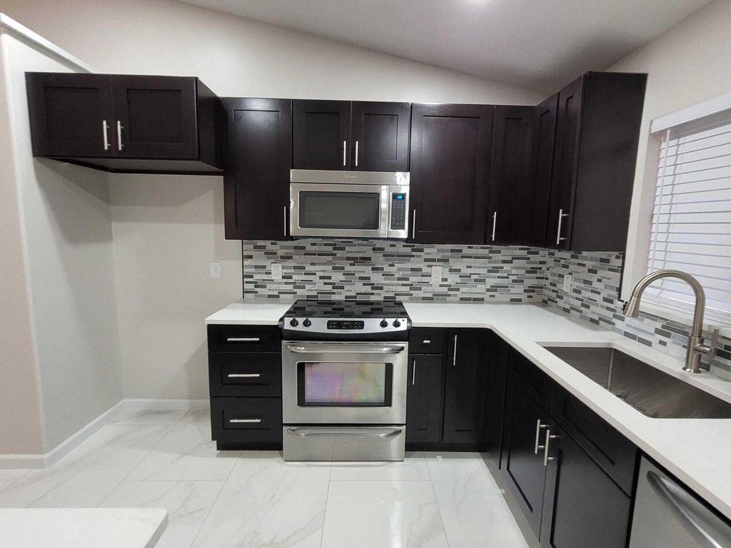 Photo of 7605 Woodland Creek Lane, Lake Worth, FL 33467 (MLS # R10976194)