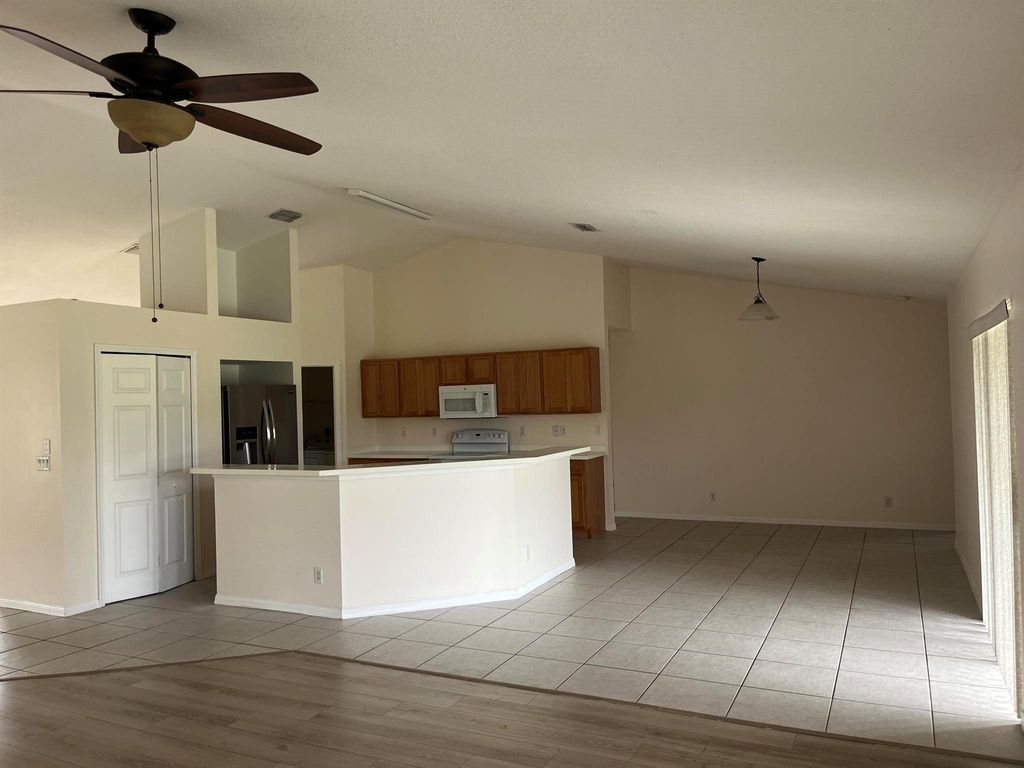 Photo of 981 SW Versailles Avenue, Port Saint Lucie, FL 34953 (MLS # R11087042)