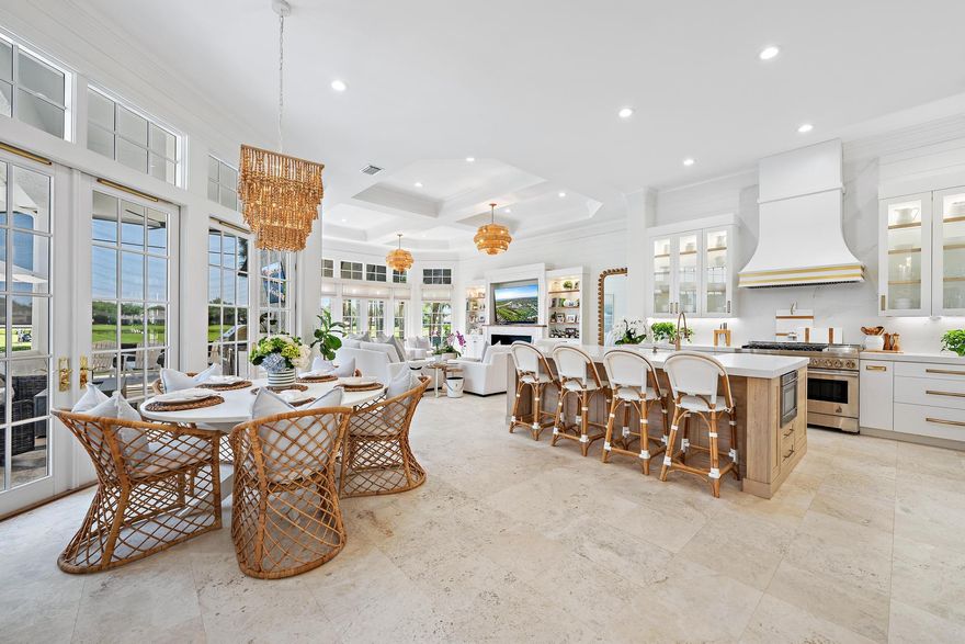 Major Price Reduction! Owner has purchased their new home - looking for a quick sale and would entertain including the furnishings for an easy transition for the Buyer...Move In Ready!!  Nestled on one of the most coveted lots in Old Marsh Golf Club, this fully renovated luxury residence offers a lifestyle of unparalleled elegance and ease. Expansive eastern views that stretch across the iconic 9th and 18th holes of the Pete Dye Championship Golf Course, the home is perfectly positioned to showcase the stately clubhouse perched atop the greens, with a shimmering lake as its centerpiece. Inside, the sunlit interiors are nothing short of breathtaking.The custom-designed kitchen is a masterpiece, featuring top-of-the-line appliances and exquisite finishes. Cozy fireplace, stunning wine wall, and seamless indoor-outdoor living spaces elevate the home's sophistication. Step outside to your private oasis, where a glistening pool and summer kitchen are surrounded by motorized screens for privacy and sun protection, and a lushly landscaped yard with a putting green await. Thoughtful touches like extensive landscape lighting add a magical ambiance for evening entertaining. This residence is situated on one of the community's most prestigious streets, home to just 11 of Old Marsh's 180 exclusive custom estates. Its exceptional location is mere steps from the first tee, Har-Tru tennis courts, and the elegant clubhouse, where social gatherings and fine dining are seamlessly woven into everyday life. Beyond the gates, you're just 15 miles from Palm Beach International Airport, minutes from world-class dining and shopping on Worth Avenue, and a short drive to the turquoise waters of the Atlantic Ocean in Juno Beach. Old Marsh Golf Club is a private sanctuary, revered for its award-winning design, no tee time policy, and distinguished caddie program. With only 275 members and a commitment to exclusivity, it's widely regarded as one of Palm Beach County's premier gated club communities.  This is more than a home—it's a lifestyle of perfection. While furnishings are not included in the purchase price, the seller is open to negotiating a fully furnished sale for a seamless move-in experience.