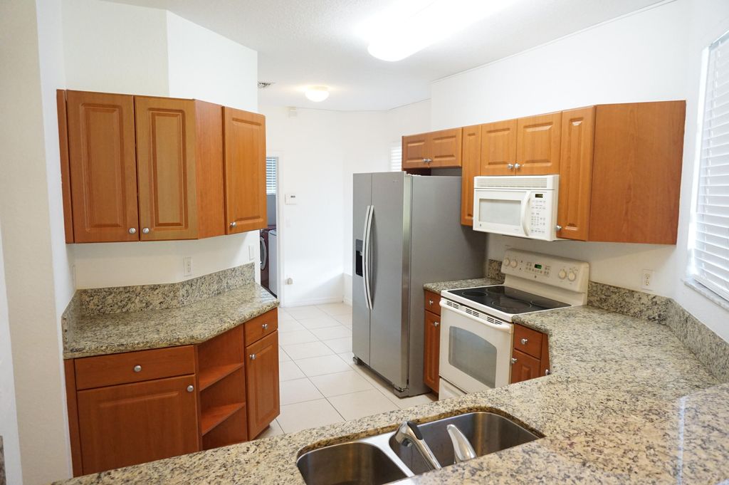 Photo of 1923 Alamanda Way, Riviera Beach, FL 33404 (MLS # R10990525)