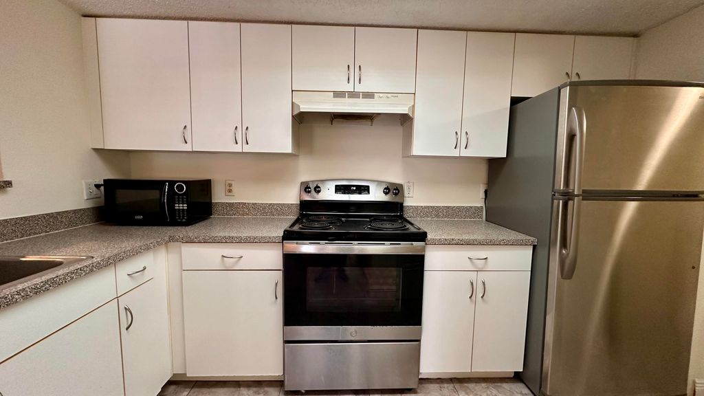 Photo of 5001 Wiles Road #103, Coconut Creek, FL 33073 (MLS # R10993912)